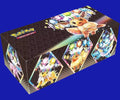 Angled view of the Pokémon TCG: Prismatic Evolutions Surprise Box featuring Eevee and multiple Eeveelutions with crystal crowns on a black geometric background