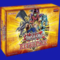 Yu-Gi-Oh! Trading Card Game Retro Pack 4-Pack Mini Box featuring Yami Yugi holding a Duel Monsters card, with Dark Magician and Blue-Eyes White Dragon artwork on a gold background.